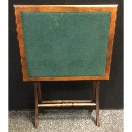 77 - An Edwardian campaign games table, 68.5cm high x 61.5cm wide x 50.5cm;  an early 20th century oak fi... 