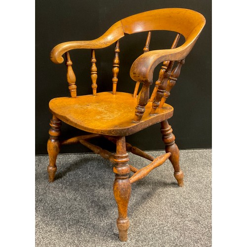 80 - A Victorian Elm and Beech ‘Captain’s’ armchair, or Smoker’s bow (originally from Chesterfield Police... 