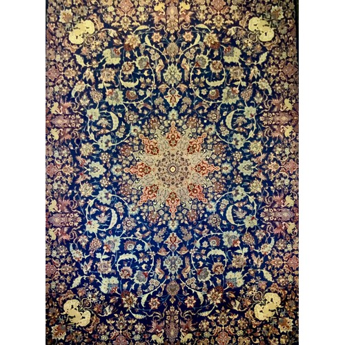 84 - A Meshed carpet, central floral medallion within blue field ground, with floral motifs, the edges an... 