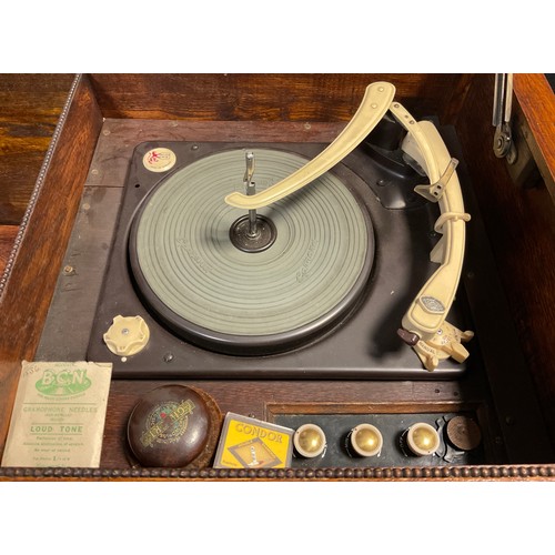 91 - A Garrard RC 120 Mk. II four speed ‘Record changer system’ turn-table, c.1958, in an oak cabinet, 76... 