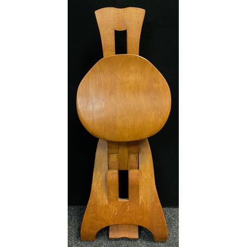 92 - A Brutalist style folding oak chair, in the manner of De Puydt, 90.5cm high x 41cm wide x 51cm deep ... 