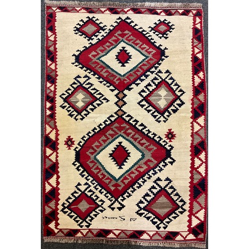 94 - A South West Persian Qashga’i Kilim rug / carpet, knotted with diamond-form medallions in bold colou... 