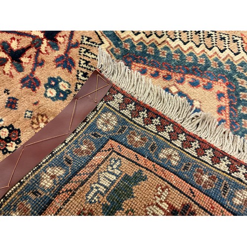 95 - A North West Persian Yallemeh runner carpet, knotted with a row of four diamond-shaped medallions, w... 