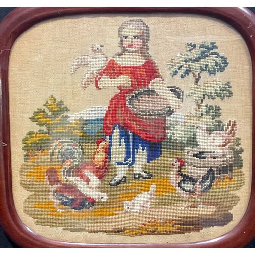 2130 - An 19th century woolwork picture, worked in coloured wools with a sportsman hunter alongside his hor... 