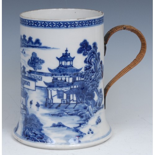 104 - A Chinese blue and white Bridge pattern porter mug, painted with bridge, pagodas, figures and trees,... 