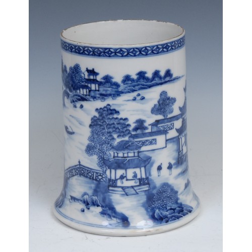 104 - A Chinese blue and white Bridge pattern porter mug, painted with bridge, pagodas, figures and trees,... 