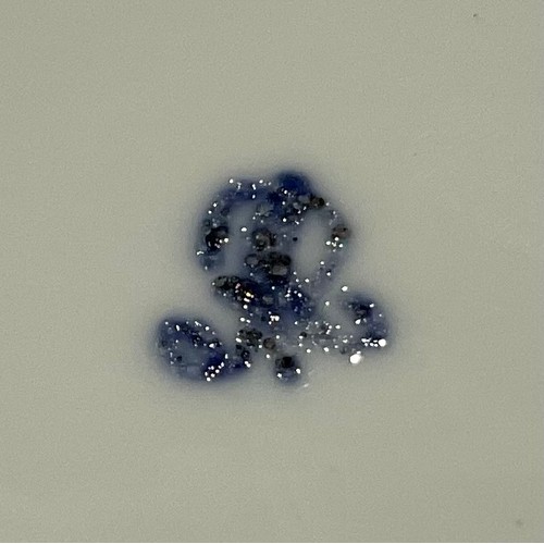 161 - A Meissen floral encrusted miniature teacup and saucer, painted with beetle, insects and blossom, gi... 