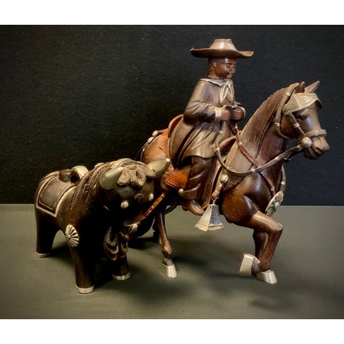 105 - A Peruvian Fernando Castro silver mounted figure, child riding a Goucho style horse, stamped with ma... 