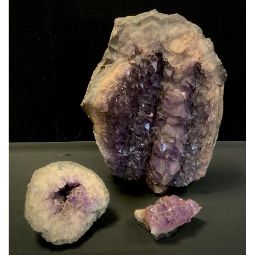 106 - Geological interest - a large Amethyst druzy geode section, 32cm x 22cm;  and a smaller semi-spheric... 