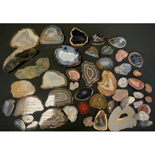 108 - Geological interest - a collection of Agate slices, with some pairs, various colours, some with Druz... 