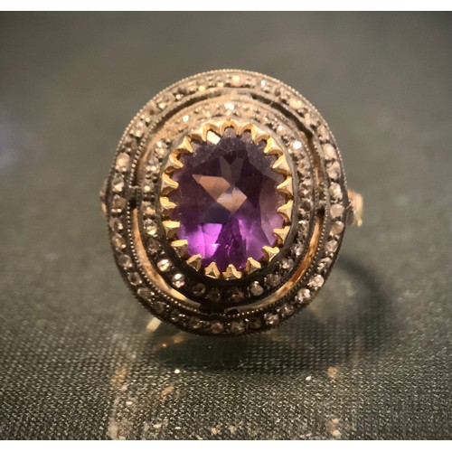 428 - A 19th century style rose cut diamond and amethyst cluster ring, central oval pale purple amethyst s... 