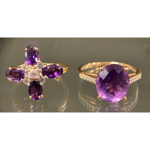 443 - An amethyst and white zircon cross cluster ring, 9ct gold shank, size N, 2.7g gross,  another oval f... 