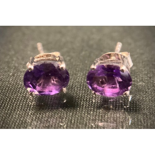 471 - A pair of oval amethyst stud earrings, silver mounts, 1.5g gross