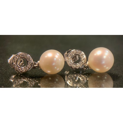 477 - A pair of diamond and cultured pearl drop earrings, each with a halo ring of thirteen round brillian... 