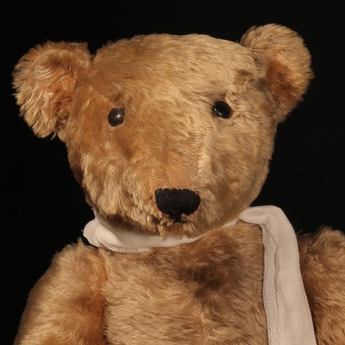 81 - A large early 20th century jointed golden mohair teddy bear, attributed to Steiff (Germany) and affe... 