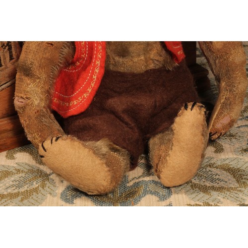 82 - An early 20th century jointed golden mohair teddy bear, attributed to Steiff (Germany), black boot b... 