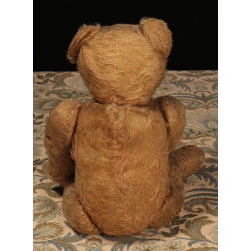 83 - An early 20th century jointed golden mohair teddy bear, attributed to Steiff (Germany), black boot b... 