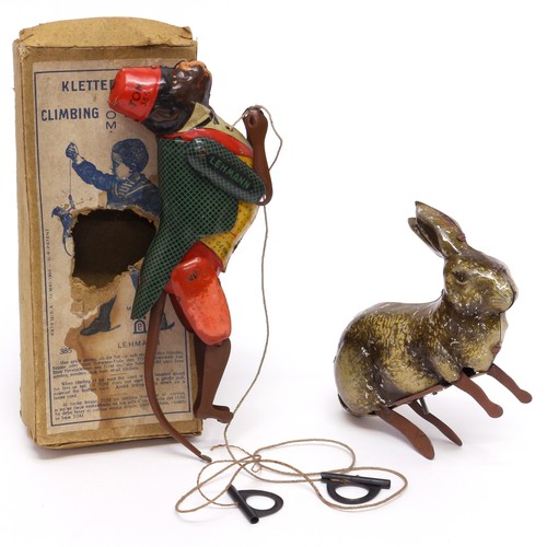 117 - An early 20th century tinplate and clockwork toy, in the form of a Rabbit, lithographed detail, unma... 