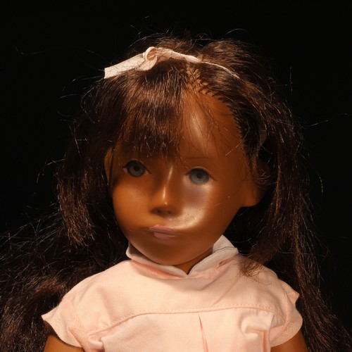 135 - A Götz Sasha Morgenthaler doll with brown hair, wearing a pink shirt with white collar and pink shor... 