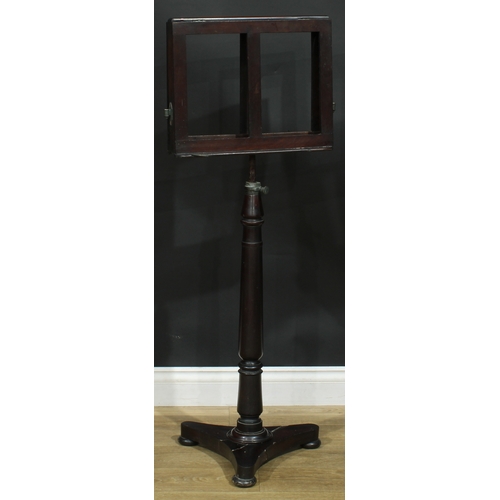 2176 - A 19th century mahogany music stand, turned column, incurve triform base, bun feet, 113cm raising to... 