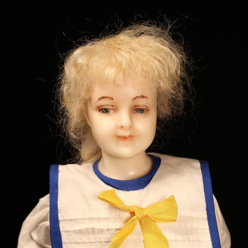 152 - A late 19th century poured wax shoulder head doll, the poured wax shoulder head with painted feature... 