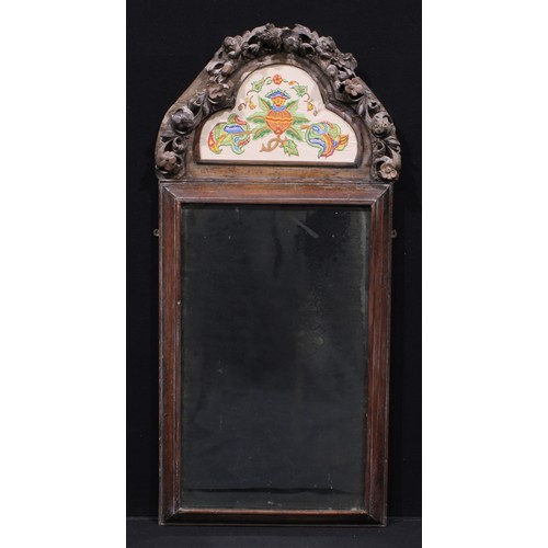 1626A - A Charles II carved cushion framed wall mirror, the lofty trefoil cresting carved with cherubs and f... 