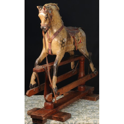 176 - A late 19th century English wooden rocking Horse, of small proportions, attributed to Frederick Henr... 