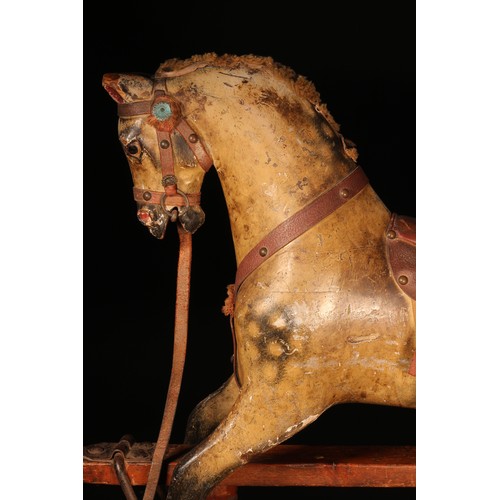 176 - A late 19th century English wooden rocking Horse, of small proportions, attributed to Frederick Henr... 