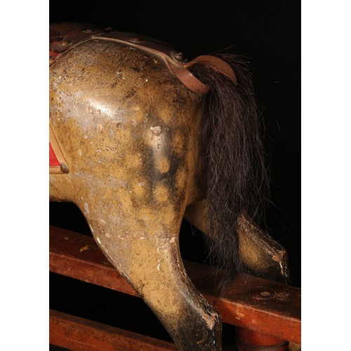 176 - A late 19th century English wooden rocking Horse, of small proportions, attributed to Frederick Henr... 