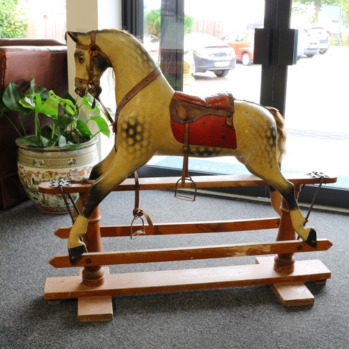 178 - A late 19th century or early 20th century English wooden rocking Horse, the carved gesso and painted... 