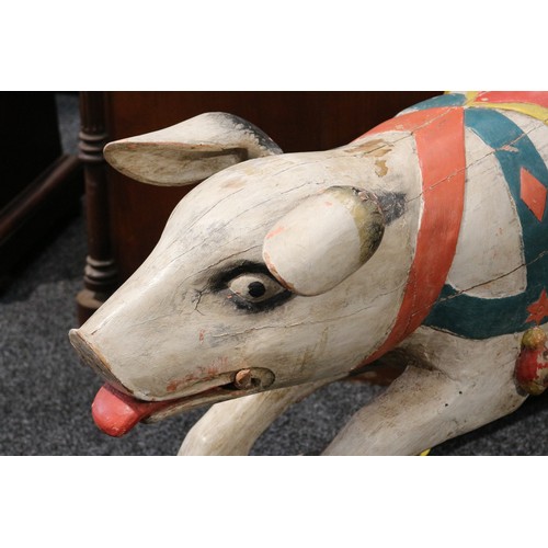 179 - Folk Art - a carved and painted wooden rocking Pig, the carved and painted Pig with pricked ears, th... 