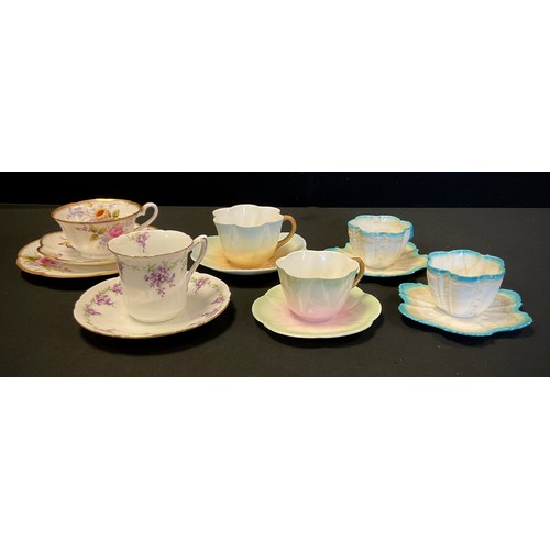 10 - A Collection of Foley China tea cups including dainty Foley China bell-shaped cup, decorated in flow... 