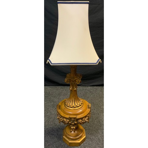 31 - Interior design - A large Italianate turned oak and gilt-wood effect table lamp, 81cm high (116cm wi... 