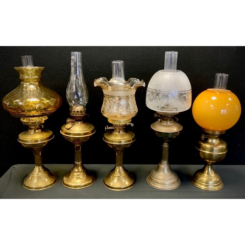 33 - A Victorian brass oil/paraffin lamp, frosted etch glass shade, others amber glass, etc.(5)