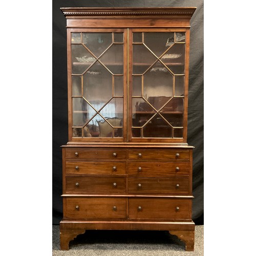 39 - An early 20th century reproduction mahogany collector’s / library cabinet, out-swept dentil cornice ... 