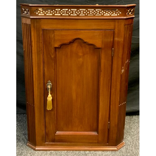 43 - A 19th century mahogany corner cupboard, pierced pediment, single door with shaped panel, 96.5cm hig... 
