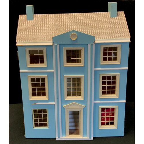51 - A 20th century three storey dolls house with fitted interior including conforming furniture, etc.