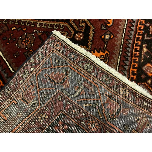 53 - A Middle Eastern Qashga’i style rug / carpet, knotted with central hexagonal-form medallion, within ... 