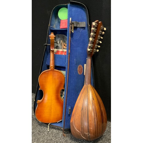 57 - Musical instruments - a 3/4 size student’s violin, cased;  and a mid 20th century Mandolin, bone tun... 