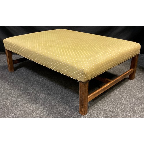 77 - A large upholstered footstool, stained beechwood frame, 36cm high x 103cm x 76cm.