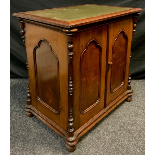 81 - A Victorian mahogany side cabinet, over-sailing rectangular top with green leather writing surface, ... 