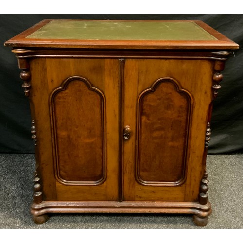 81 - A Victorian mahogany side cabinet, over-sailing rectangular top with green leather writing surface, ... 