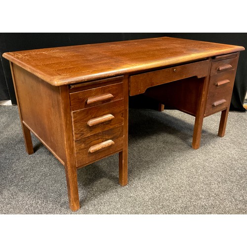 90 - A mid century oak twin pedestal desk, by Abbess, rounded rectangular top, single long drawer to frie... 