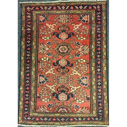 93 - A North West Persian Malayer rug / carpet, hand-knotted with a stylised floral field in red, deep bl... 