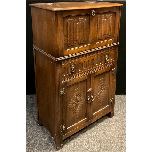 108 - A Jaycee furniture oak cocktail cabinet, 124cm high x 74.5cm wide x 42.5cm deep.