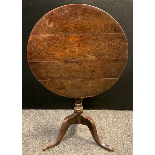 119 - A George III oak tripod occasional table, 71cm high x 71.5cm diameter.