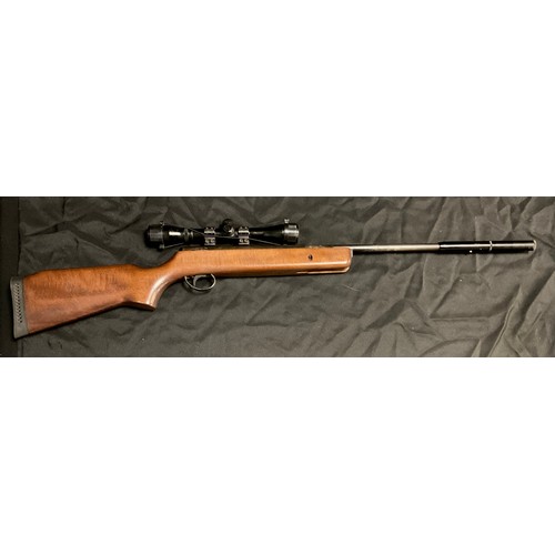 121 - A BSA .22 calibre break barrel action air rifle, serial no 815475, wooden stock, 106.5cm long, mount... 