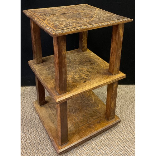 290 - A carved oak side table, the square top carved with scrolling thistle stems within a quartre-foil pa... 