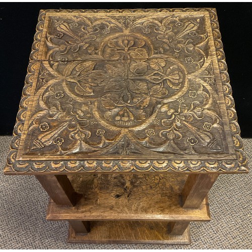 290 - A carved oak side table, the square top carved with scrolling thistle stems within a quartre-foil pa... 