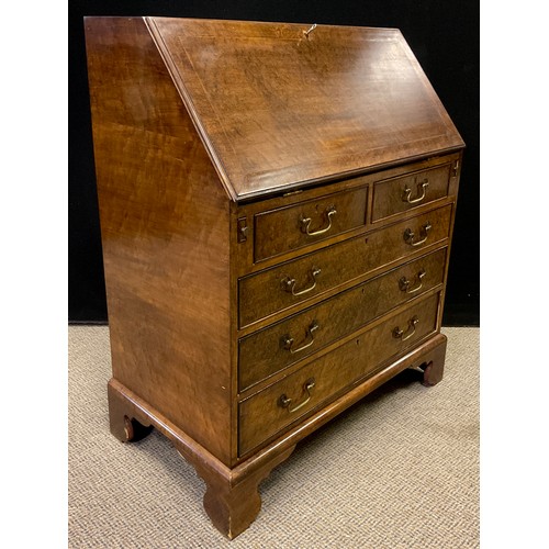 293 - A reproduction George III Bird’s-eye Maple veneered bureau, the fall top enclosing a fitted interior... 